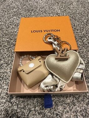Louis Vuitton Repurposed LV Zipper Pull/ charm on unbranded faux leather heart.